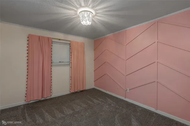 an empty room with a ceiling fan