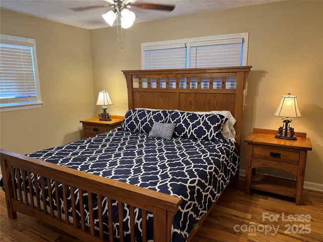 a bed room with a bed and a window