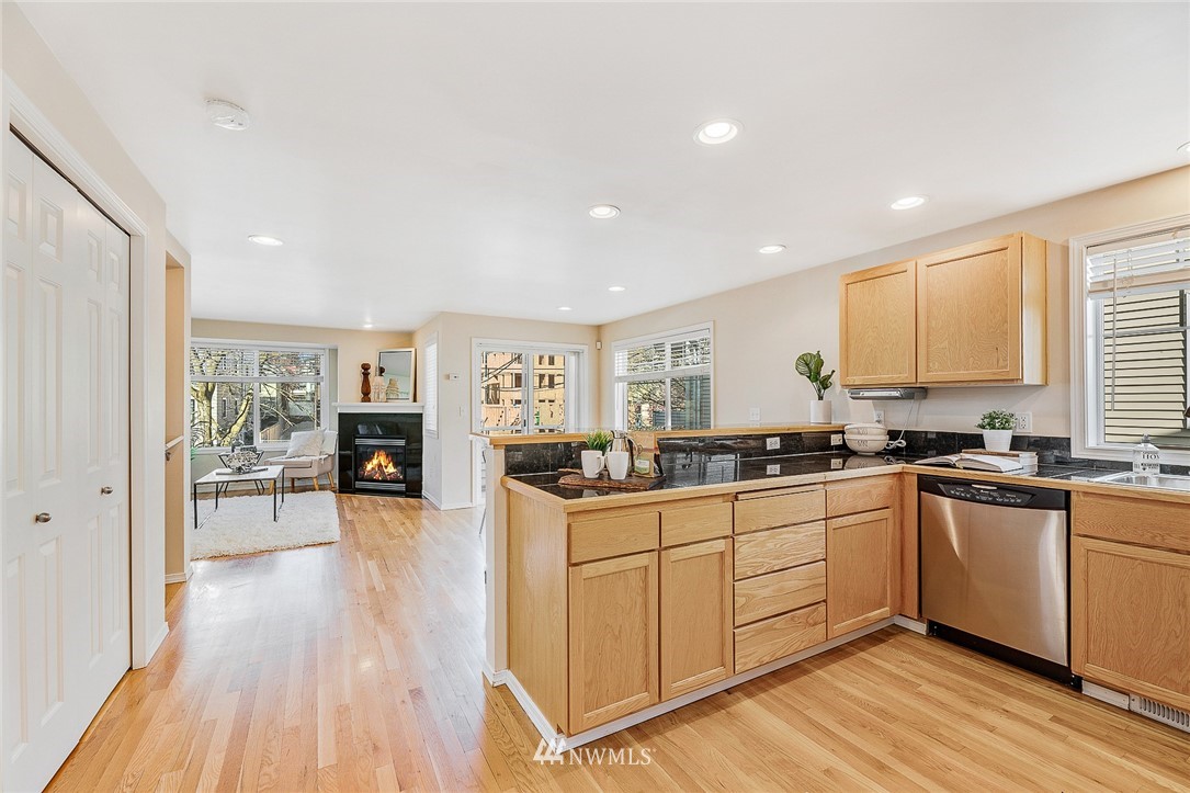 8542 B Midvale Avenue North Seattle, WA 98103 - Photo 11 of 31 a kitchen with sink a stove and cabinets