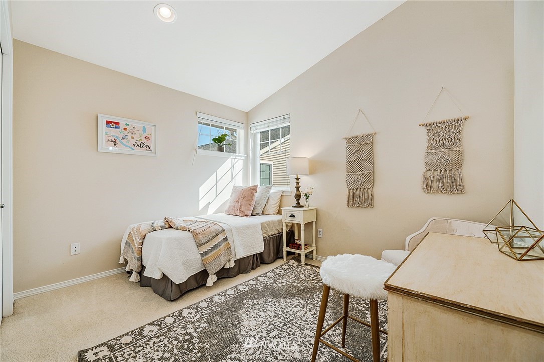 8542 B Midvale Avenue North Seattle, WA 98103 - Photo 19 of 31 a bedroom with a bed and a table in it