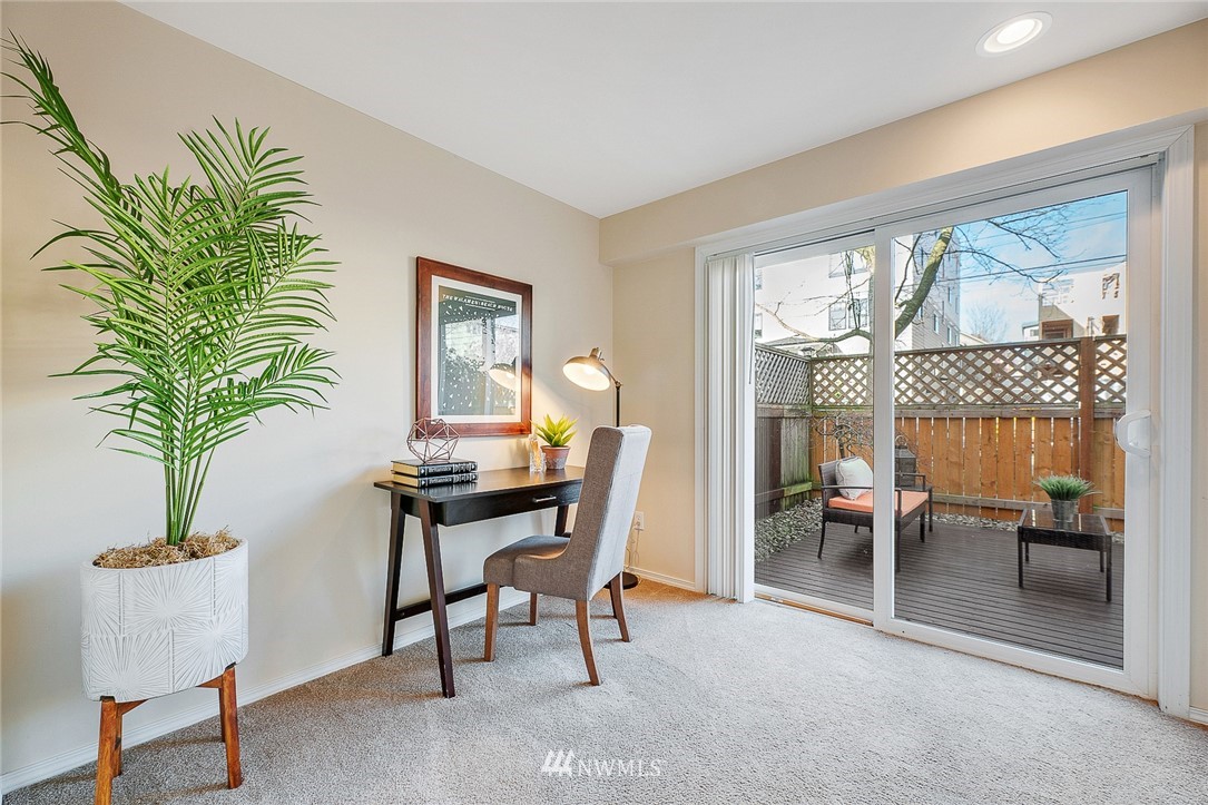 8542 B Midvale Avenue North Seattle, WA 98103 - Photo 23 of 31 a view of a livingroom with furniture and a potted plant
