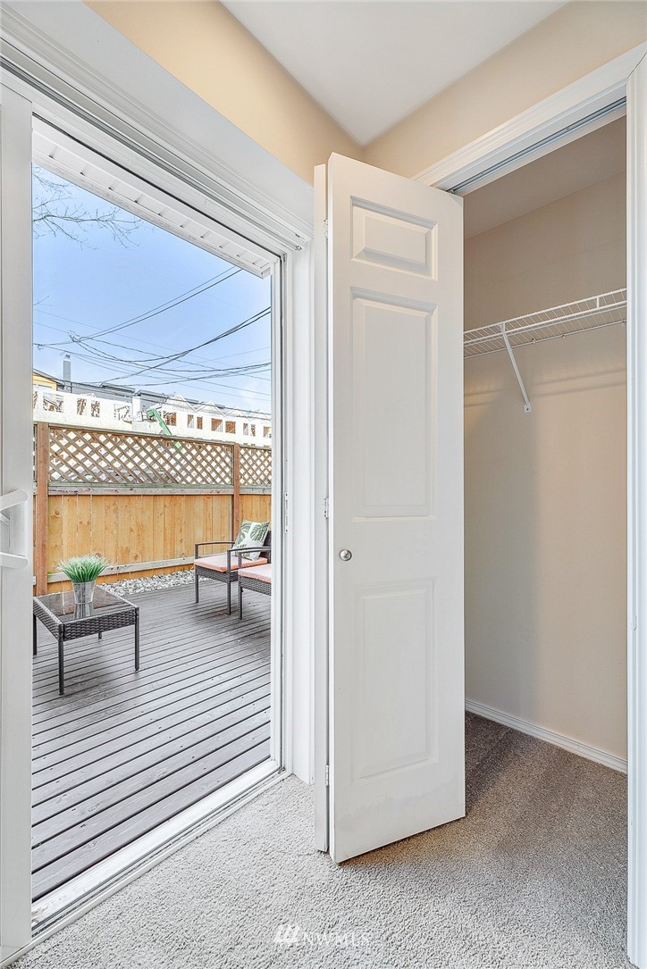 8542 B Midvale Avenue North Seattle, WA 98103 - Photo 24 of 31 a view of a bedroom with a bed and a window