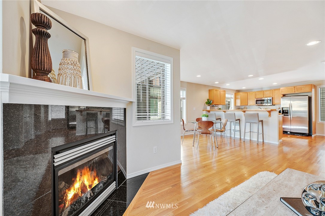 8542 B Midvale Avenue North Seattle, WA 98103 - Photo 4 of 31 a living room with furniture and a fireplace
