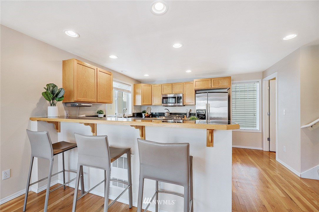 8542 B Midvale Avenue North Seattle, WA 98103 - Photo 7 of 31 a kitchen with a table and chairs