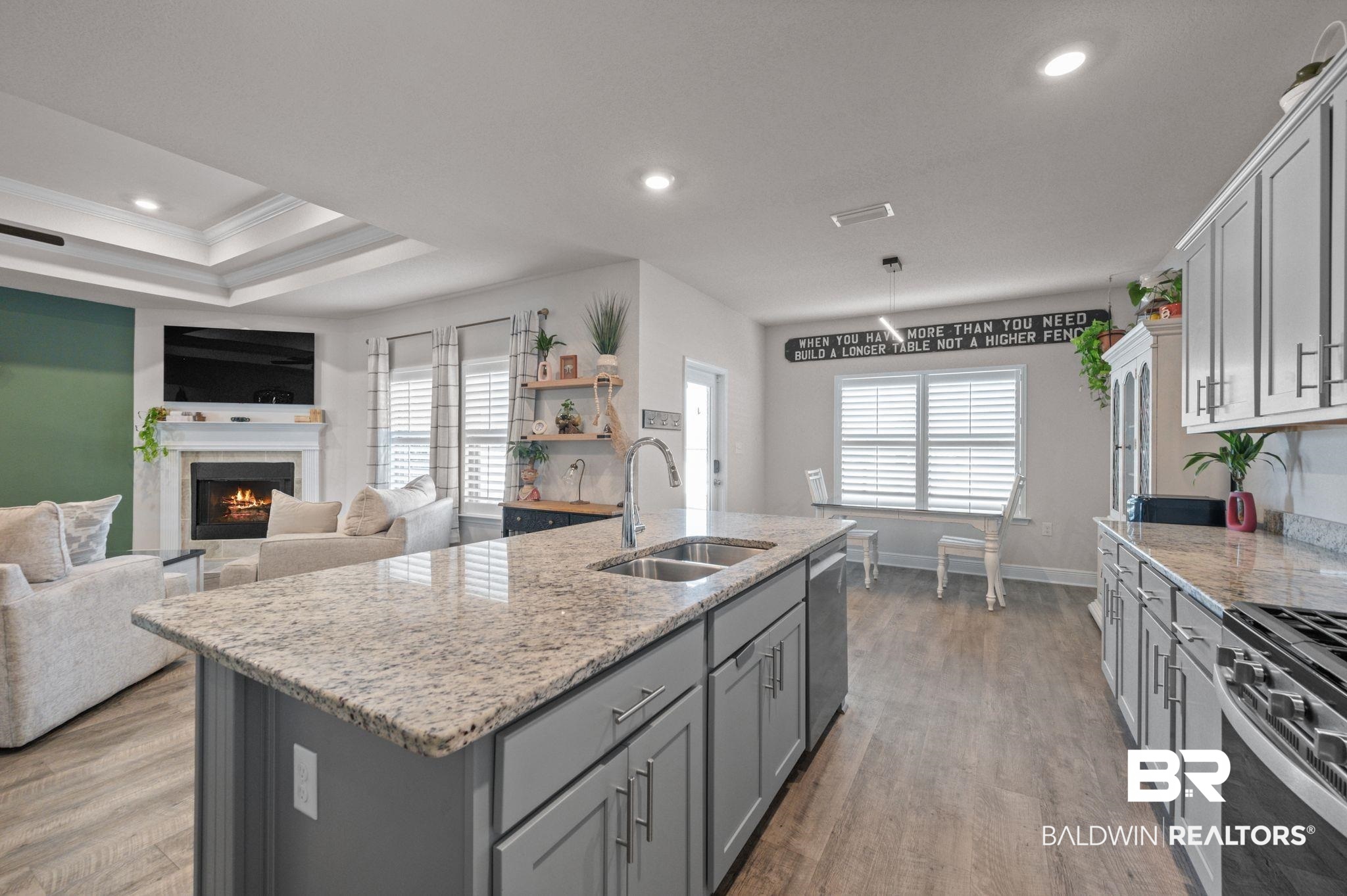 24891 Spectacular Bid Loop Daphne, AL 36526 - Photo 22 of 51 Kitchen with appliances with stainless steel finishes, sink, a center island with sink, and gray cabinetry