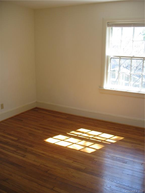 3043 Park Road Charlotte, NC 28209 - Photo 4 of 9 a view of an empty room and wooden floor
