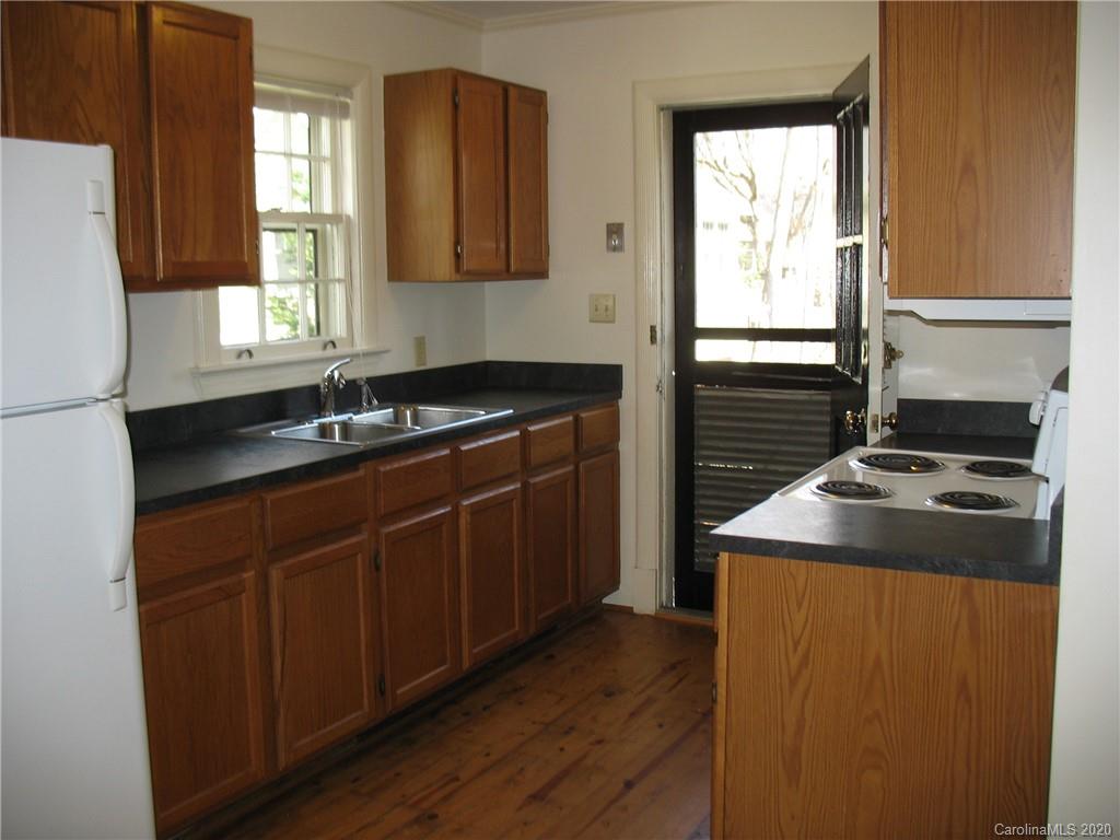 3043 Park Road Charlotte, NC 28209 - Photo 5 of 9 a kitchen with a stove a sink and a refrigerator