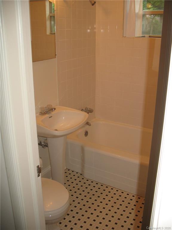 3043 Park Road Charlotte, NC 28209 - Photo 7 of 9 a bathroom with a sink a toilet and shower
