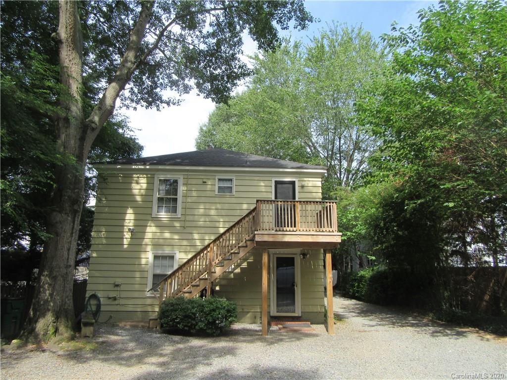 3043 Park Road Charlotte, NC 28209 - Photo 8 of 9 a front view of a house with a garden