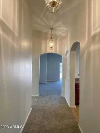 a view of a hallway with front door