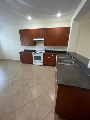 a view of room with stainless steel appliances