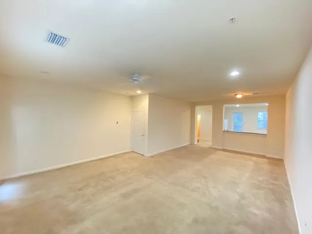 a kitchen with stainless steel appliances granite countertop a refrigerator and a stove