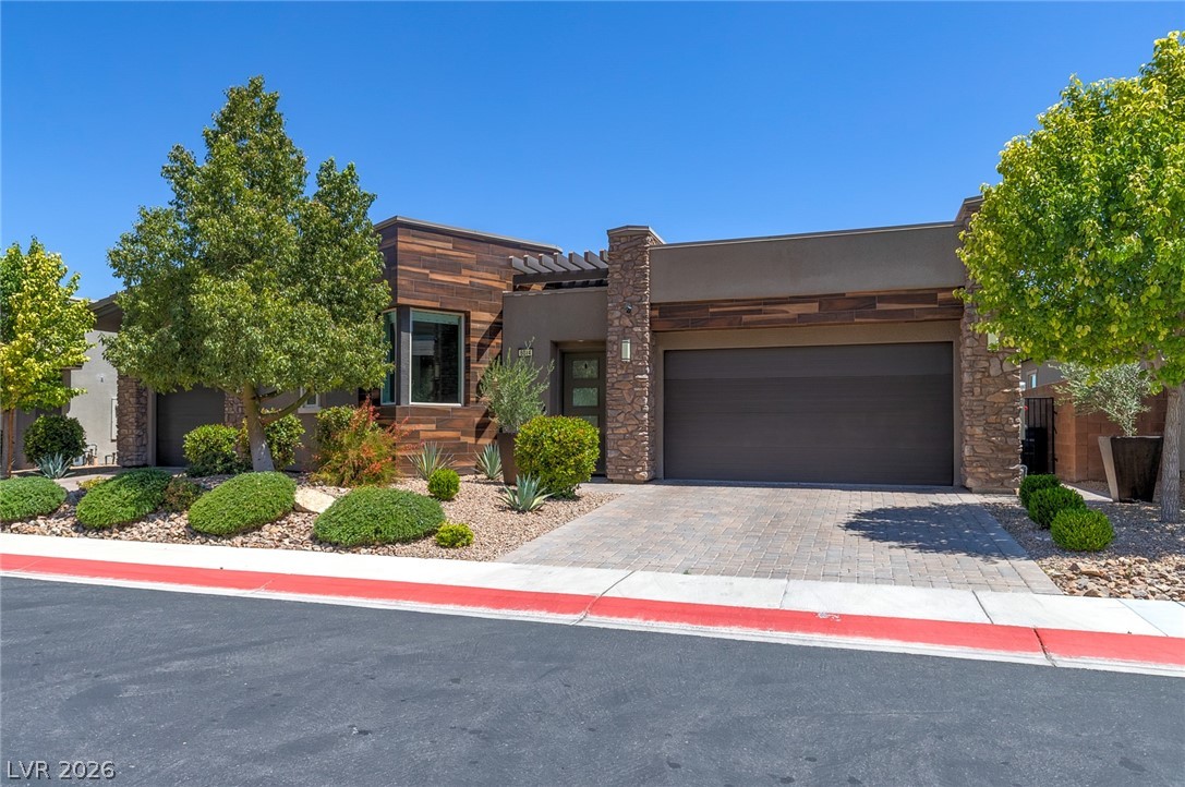 6014 Willow Ridge Court Las Vegas, NV 89135 - Photo 4 of 99 Modern desert architecture with stone and wood accents welcomes you home.