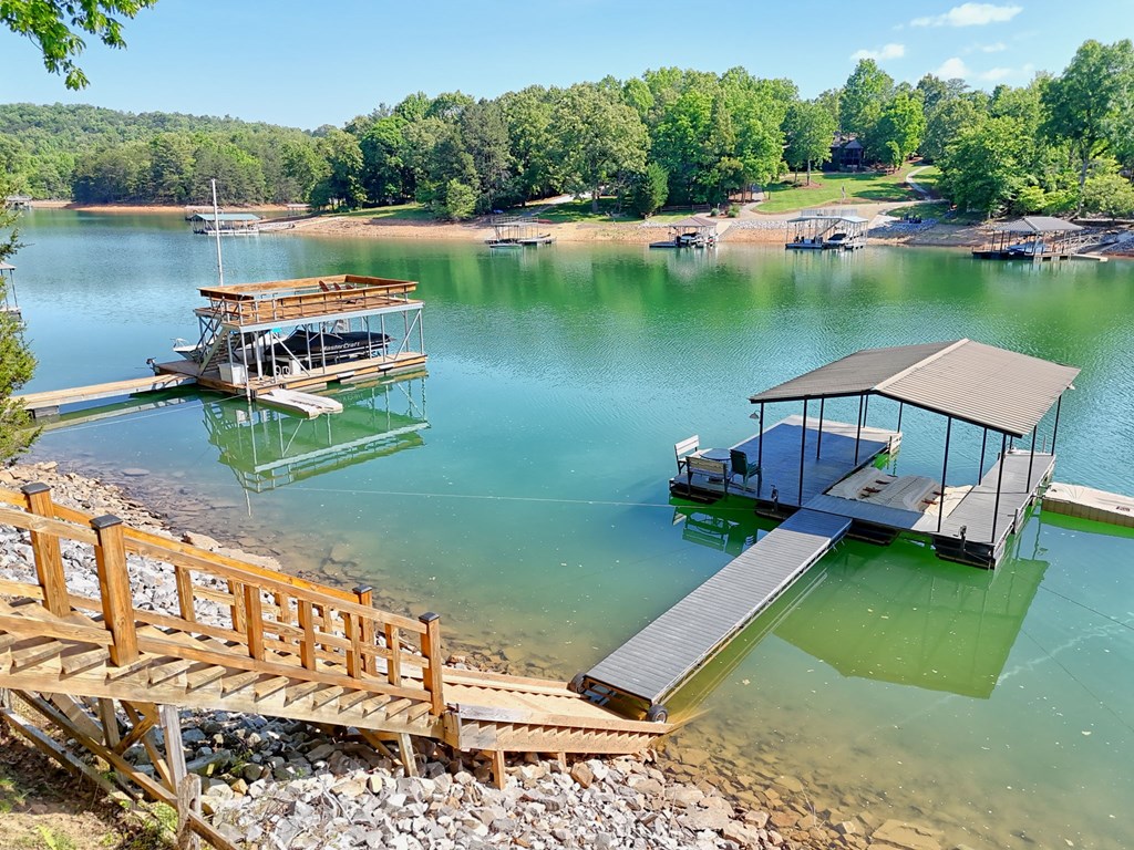 456 Deaver Cove Road Blairsville, GA 30512 - Photo 72 of 83 a view of a lake with a house in the background