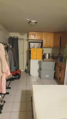 a kitchen with a refrigerator and a stove