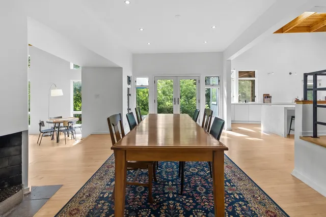 a view of a kitchen with dining table and chairs