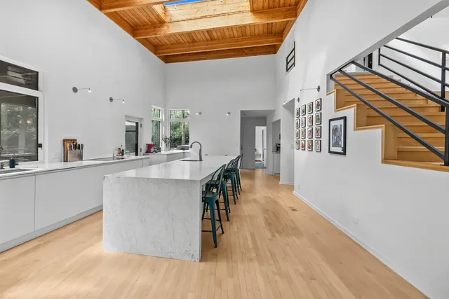 a view of living room kitchen and entryway