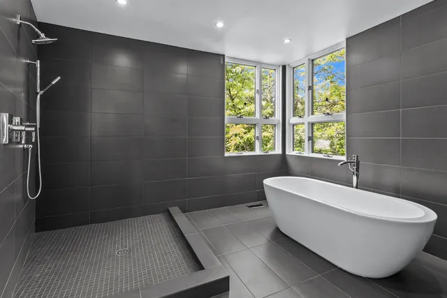 a bathroom with a bathtub and window
