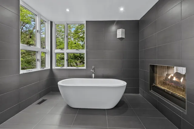 a bathroom with a bathtub and shower