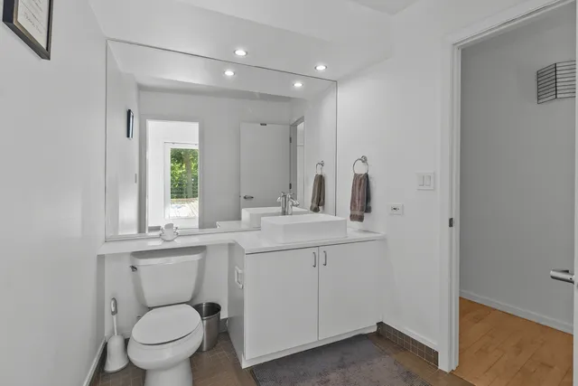 a view of a room with furniture and window