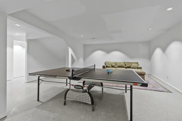 a living room with furniture and a rug