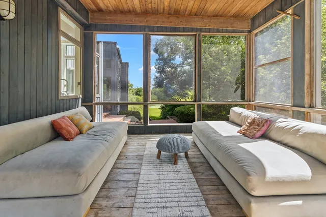 an aerial view of house with yard swimming pool and outdoor seating