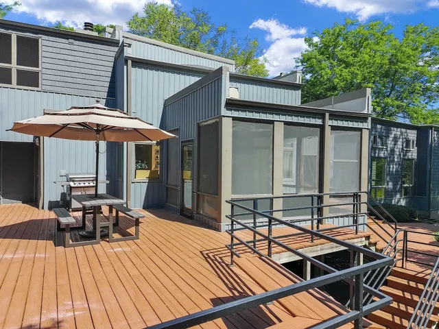a view of a field with a tree in the background