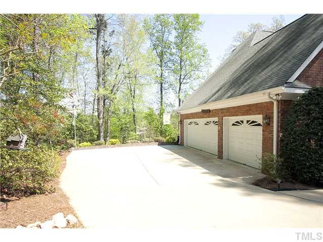 4716 Salem Ridge Road Holly Springs, NC 27540 - Photo 25 of 25 Oversized 3-car garage with large drive way and parking area. Parking Lot/Garage