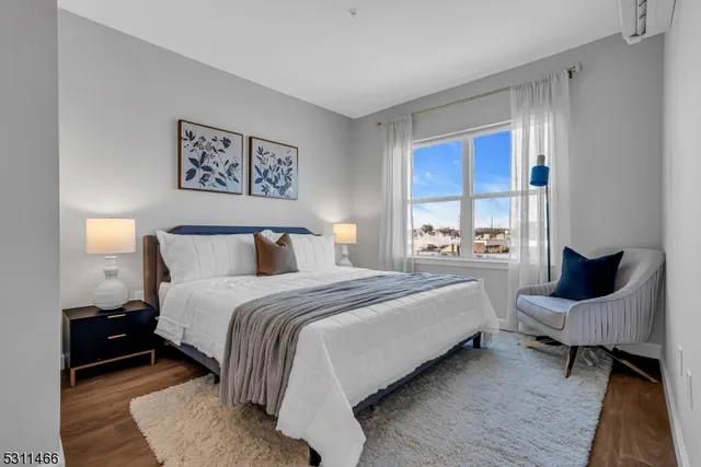 a bedroom with bed and window