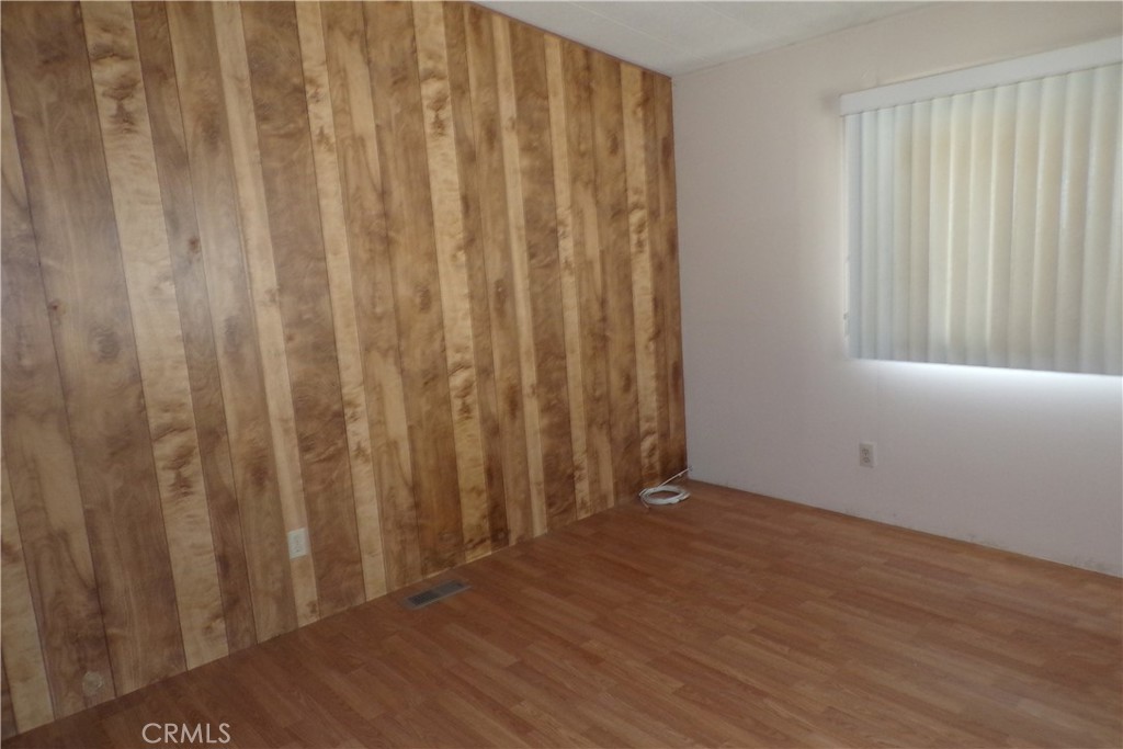 34447 Yucaipa Boulevard, Unit 2 Yucaipa, CA 92399 - Photo 14 of 16 a view of backyard with hardwood