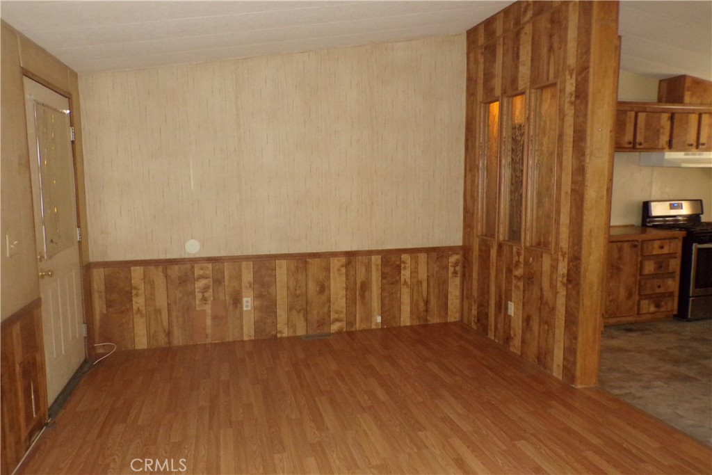 34447 Yucaipa Boulevard, Unit 2 Yucaipa, CA 92399 - Photo 4 of 16 a view of stairs with wooden floor