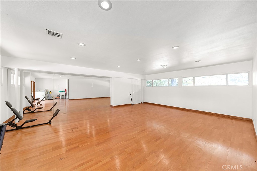 20827 East Mesarica Road Covina, CA 91724 - Photo 11 of 40 a view of an empty room with wooden floor
