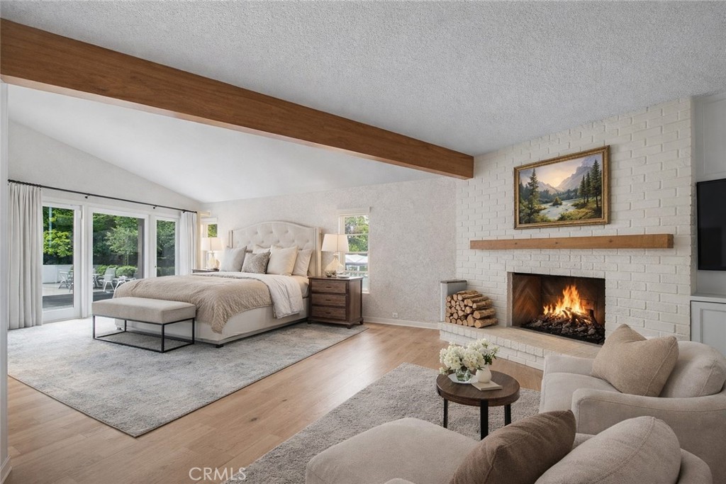 20827 East Mesarica Road Covina, CA 91724 - Photo 15 of 40 a bedroom with furniture and a fireplace