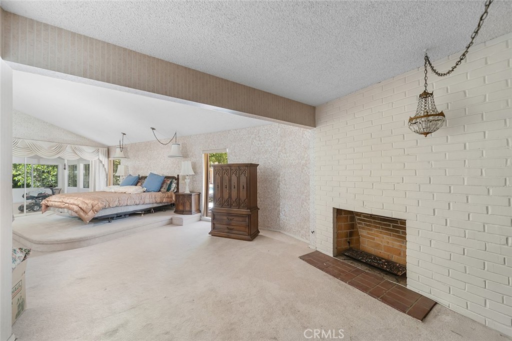 20827 East Mesarica Road Covina, CA 91724 - Photo 16 of 40 a view of a livingroom with furniture and a fireplace