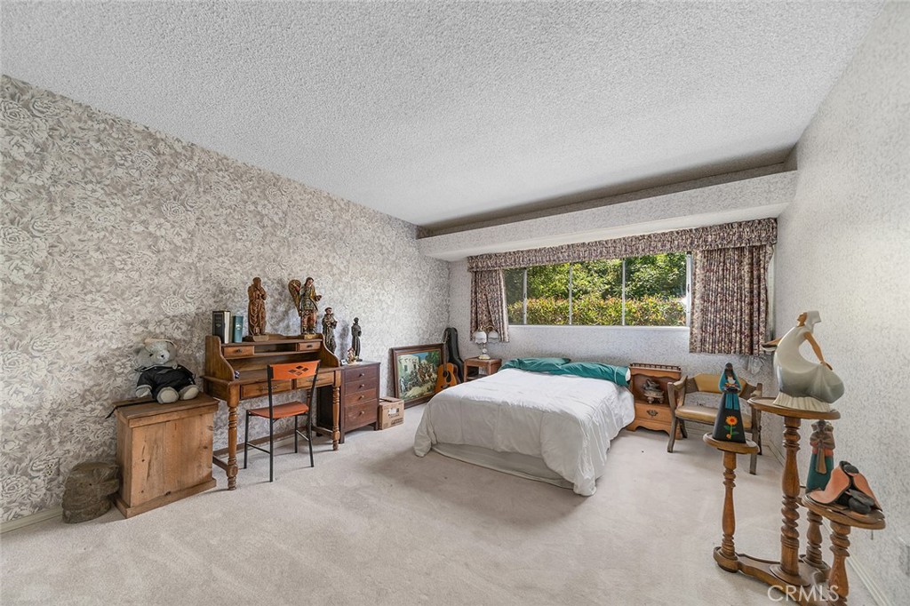 20827 East Mesarica Road Covina, CA 91724 - Photo 20 of 40 a bedroom with a bed and a desk