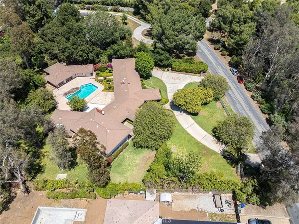 an aerial view of residential houses with outdoor space