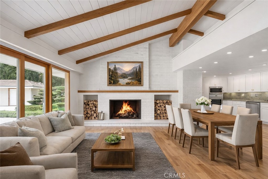 20827 East Mesarica Road Covina, CA 91724 - Photo 6 of 40 a living room with furniture dining table and a fireplace