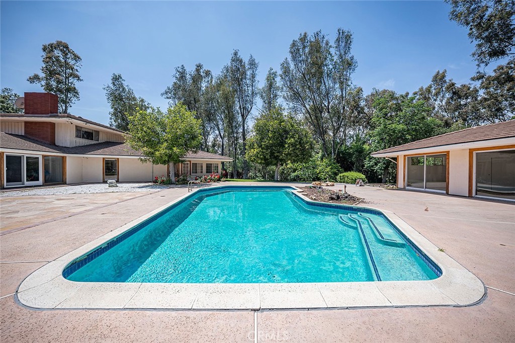 20827 East Mesarica Road Covina, CA 91724 - Photo 9 of 40 a swimming pool with outdoor seating and yard