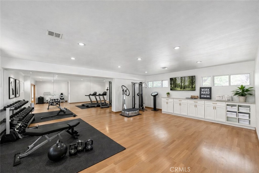 20827 East Mesarica Road Covina, CA 91724 - Photo 10 of 40 a view of a room with gym equipment and kitchen view