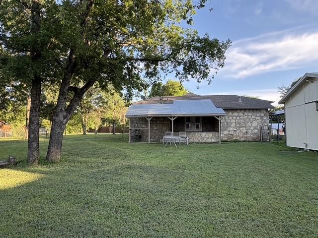 4876 East Williams Spring Road Fort Worth, TX 76135 - Photo 19 of 20 a front view of a house with a garden