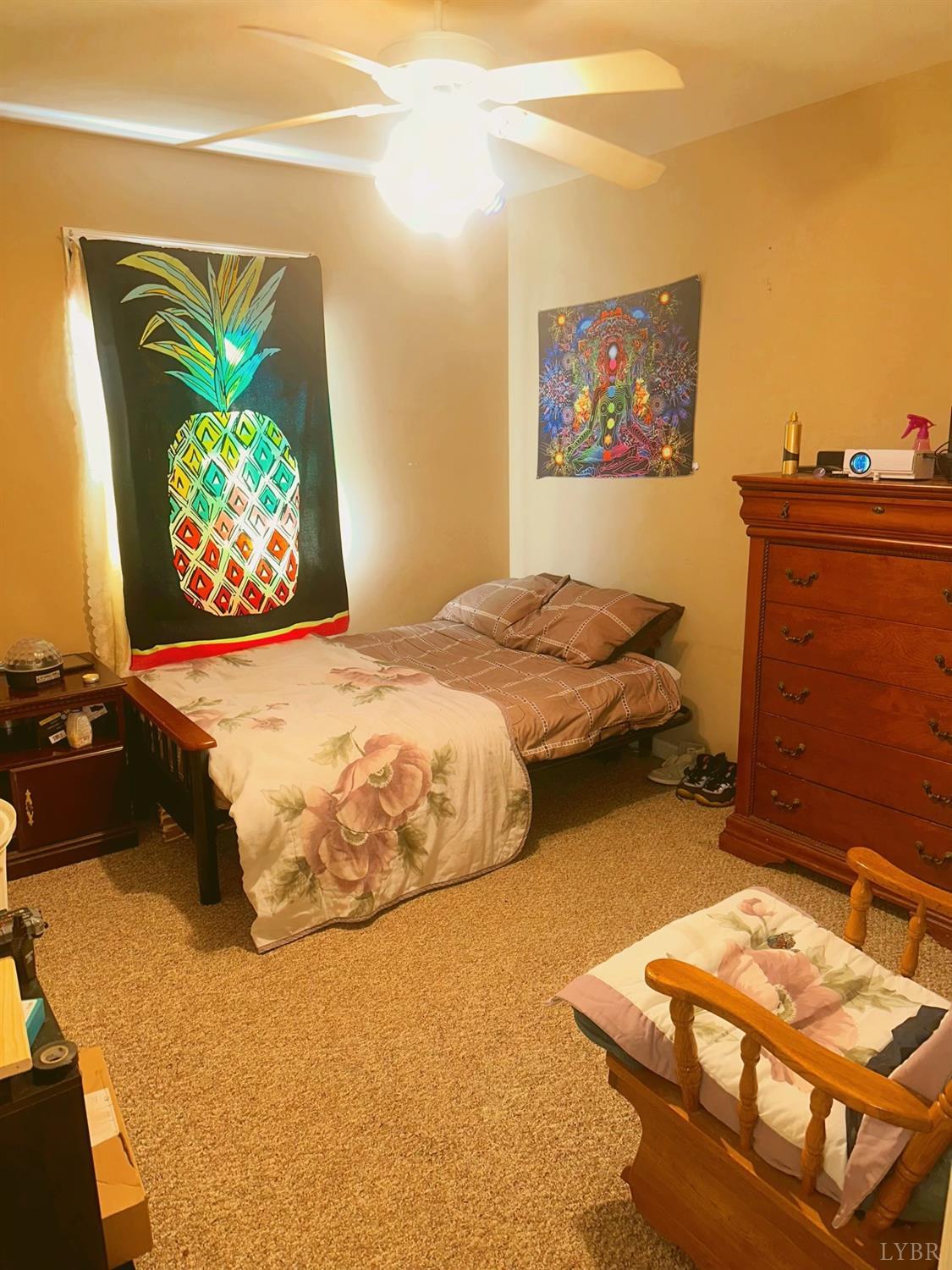 283 Country Estates Road Appomattox, VA 24522 - Photo 11 of 22 a bedroom with a bed and a flat screen tv