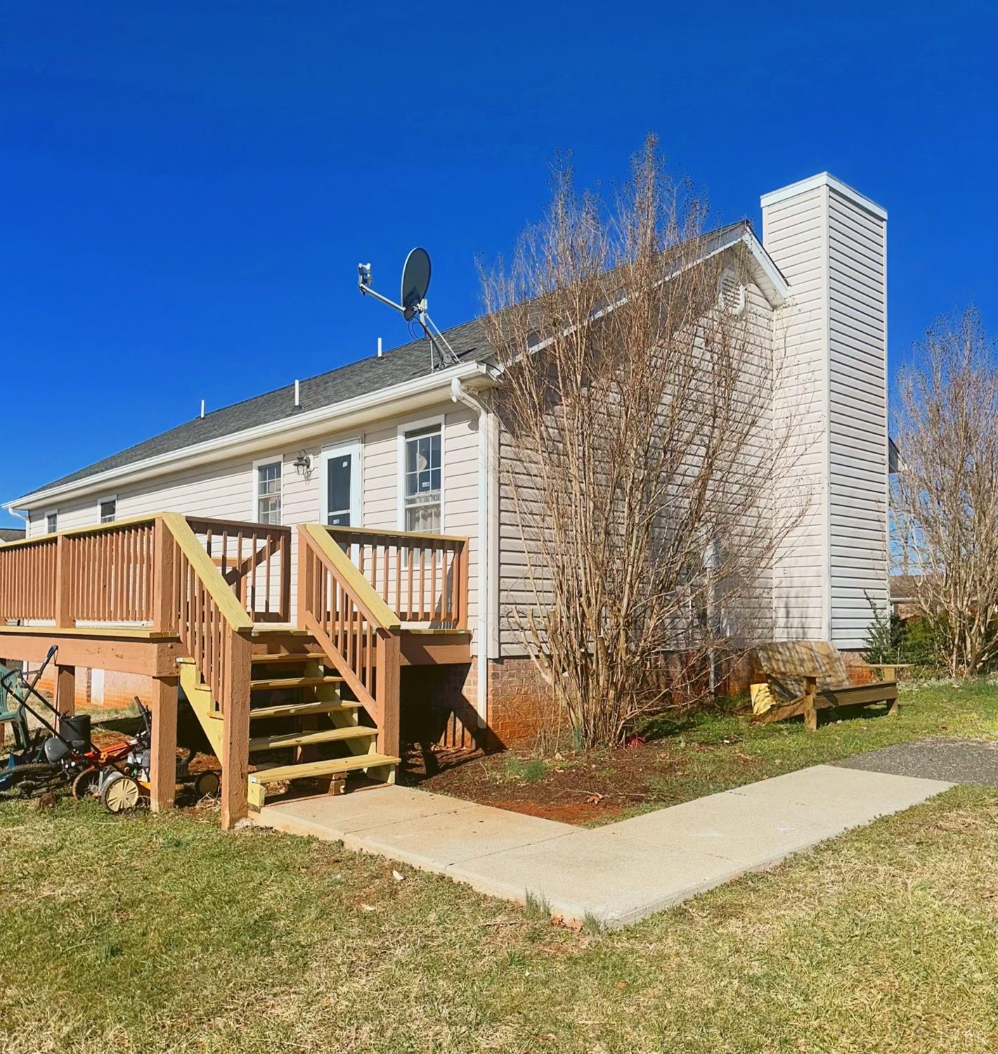 283 Country Estates Road Appomattox, VA 24522 - Photo 19 of 22 a view of a house with backyard and sitting area