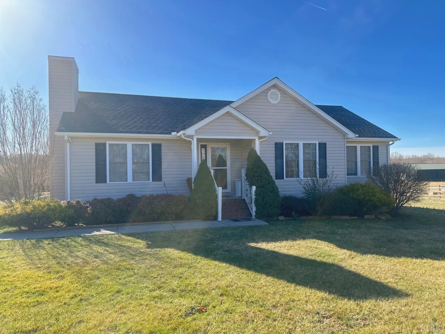 283 Country Estates Road Appomattox, VA 24522 - Photo 21 of 22 a front view of a house with a yard
