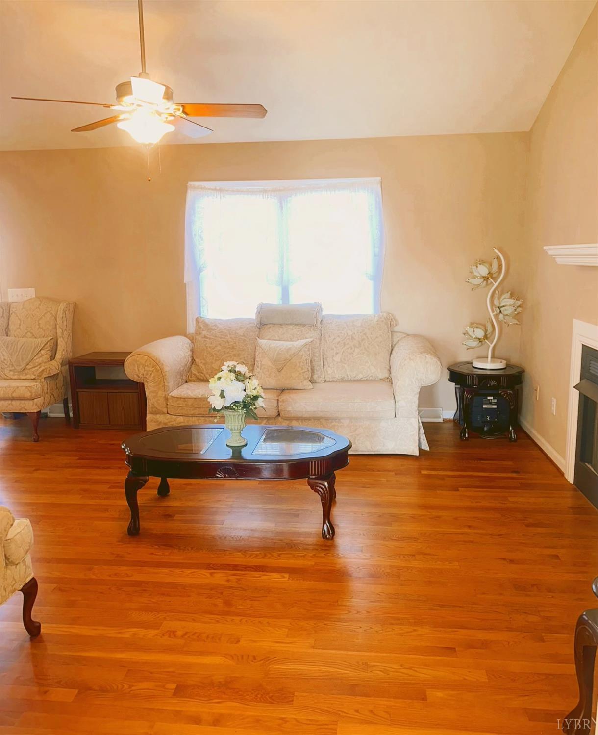 283 Country Estates Road Appomattox, VA 24522 - Photo 5 of 22 a living room with furniture and a table