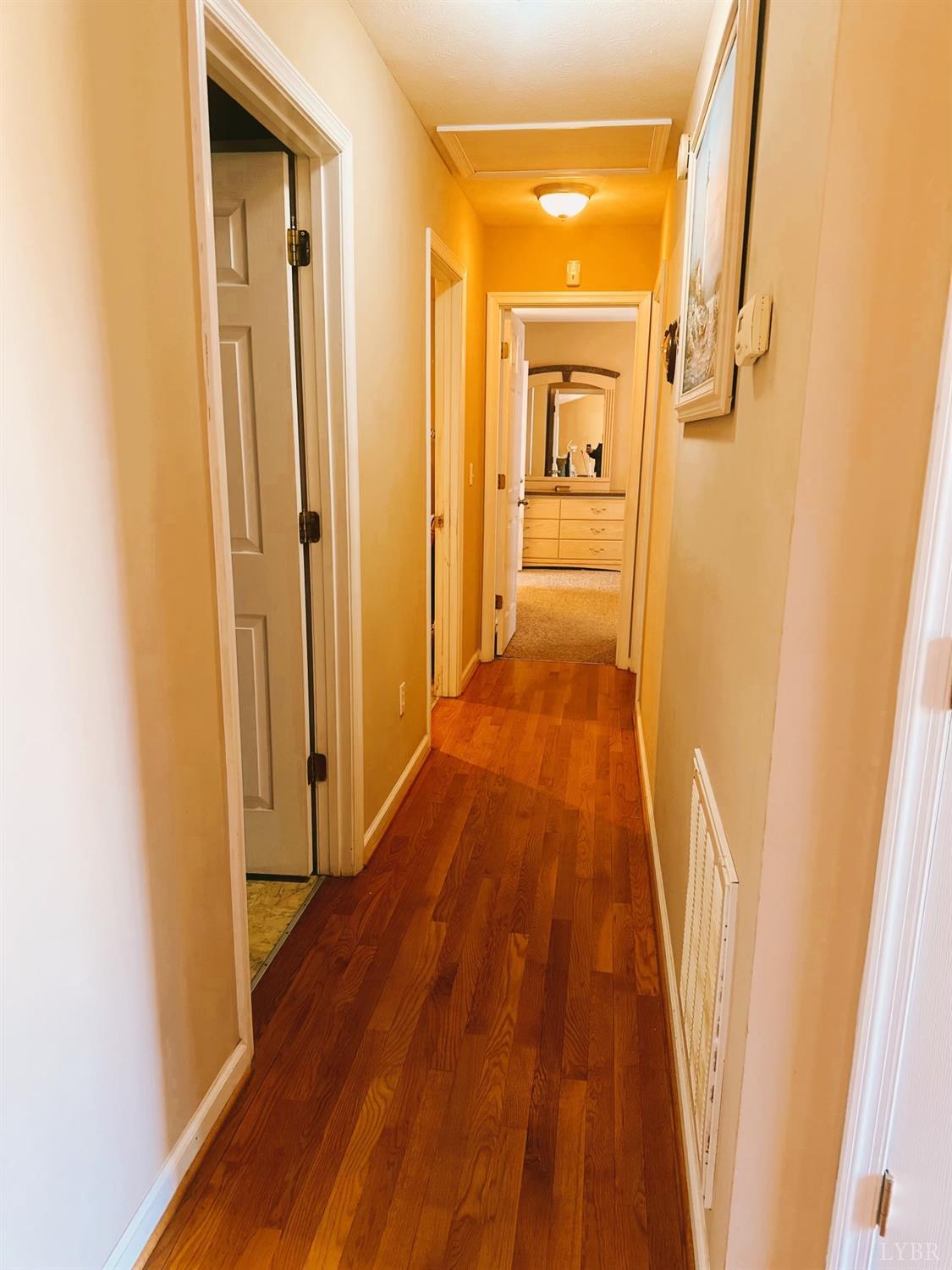283 Country Estates Road Appomattox, VA 24522 - Photo 8 of 22 a view of a hallway with wooden floor