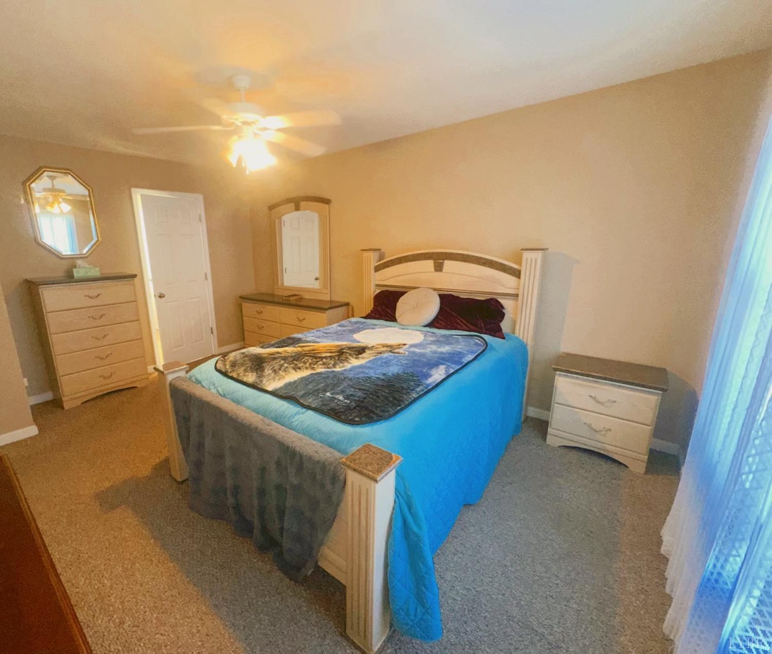 283 Country Estates Road Appomattox, VA 24522 - Photo 9 of 22 a bedroom with a bed and furniture
