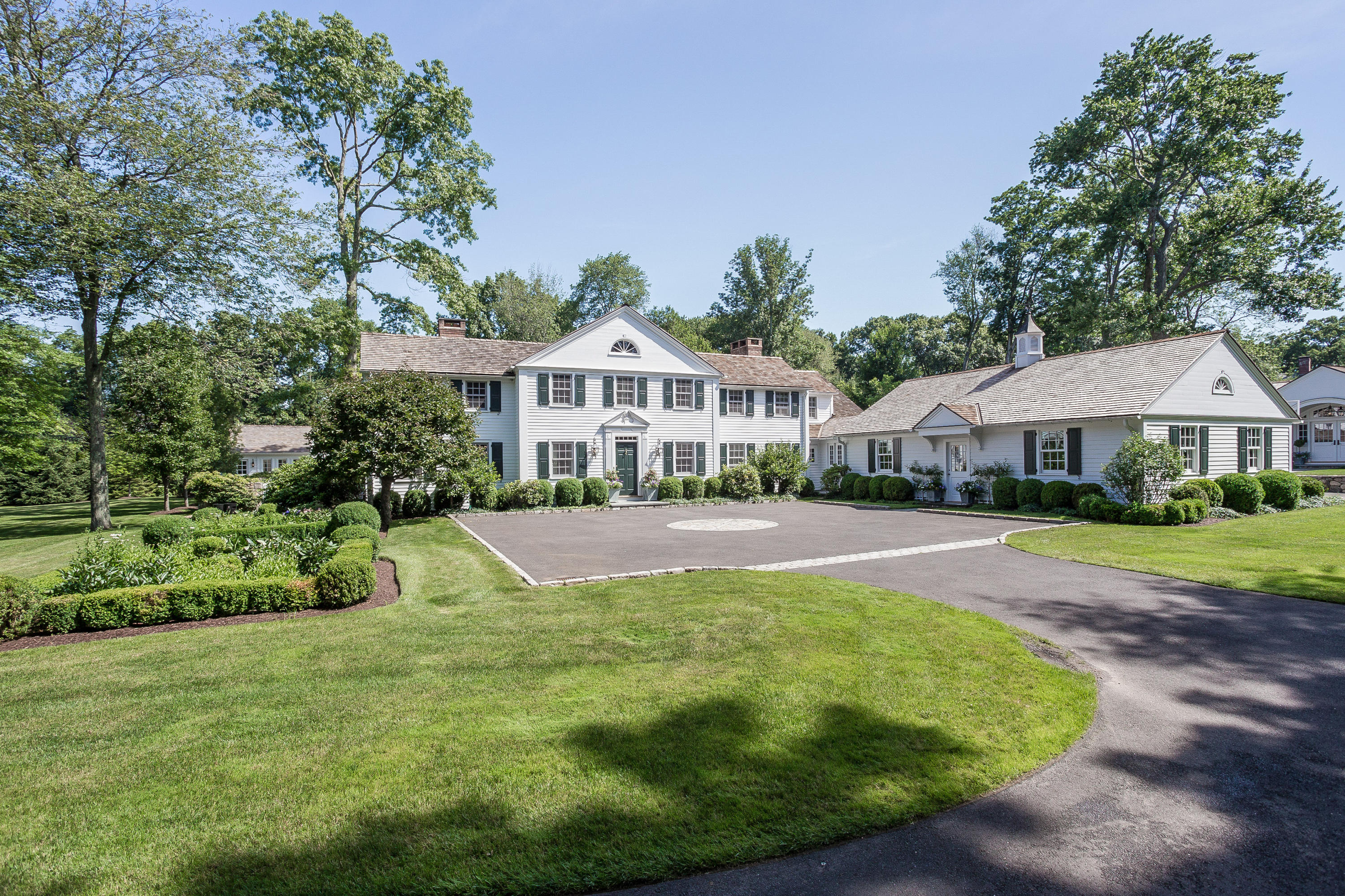 256 Brookside Road Darien, CT 06820 - Photo 2 of 66 a view of a house with swimming pool and sitting area