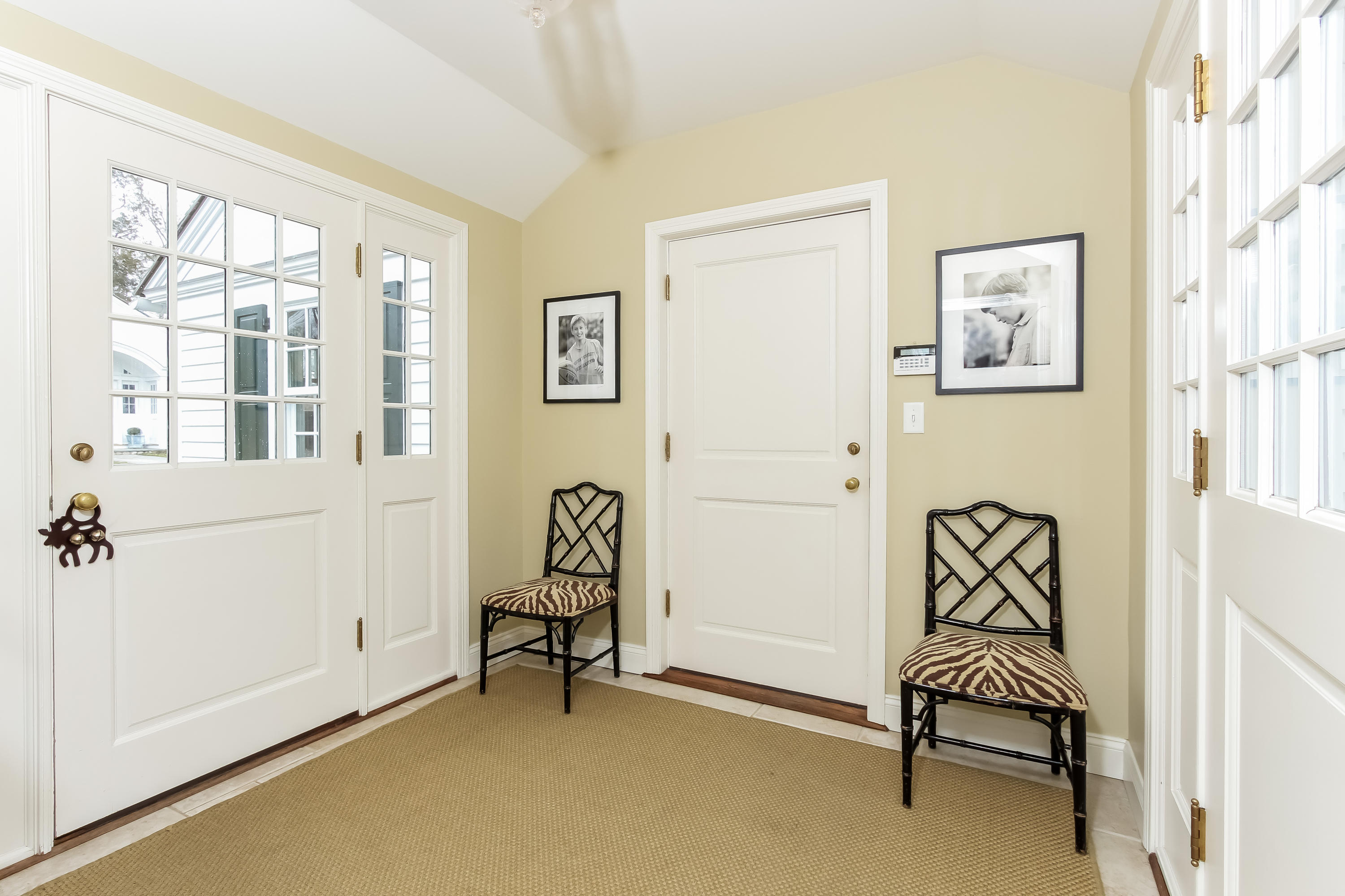 256 Brookside Road Darien, CT 06820 - Photo 26 of 66 a bedroom with a chair and a window