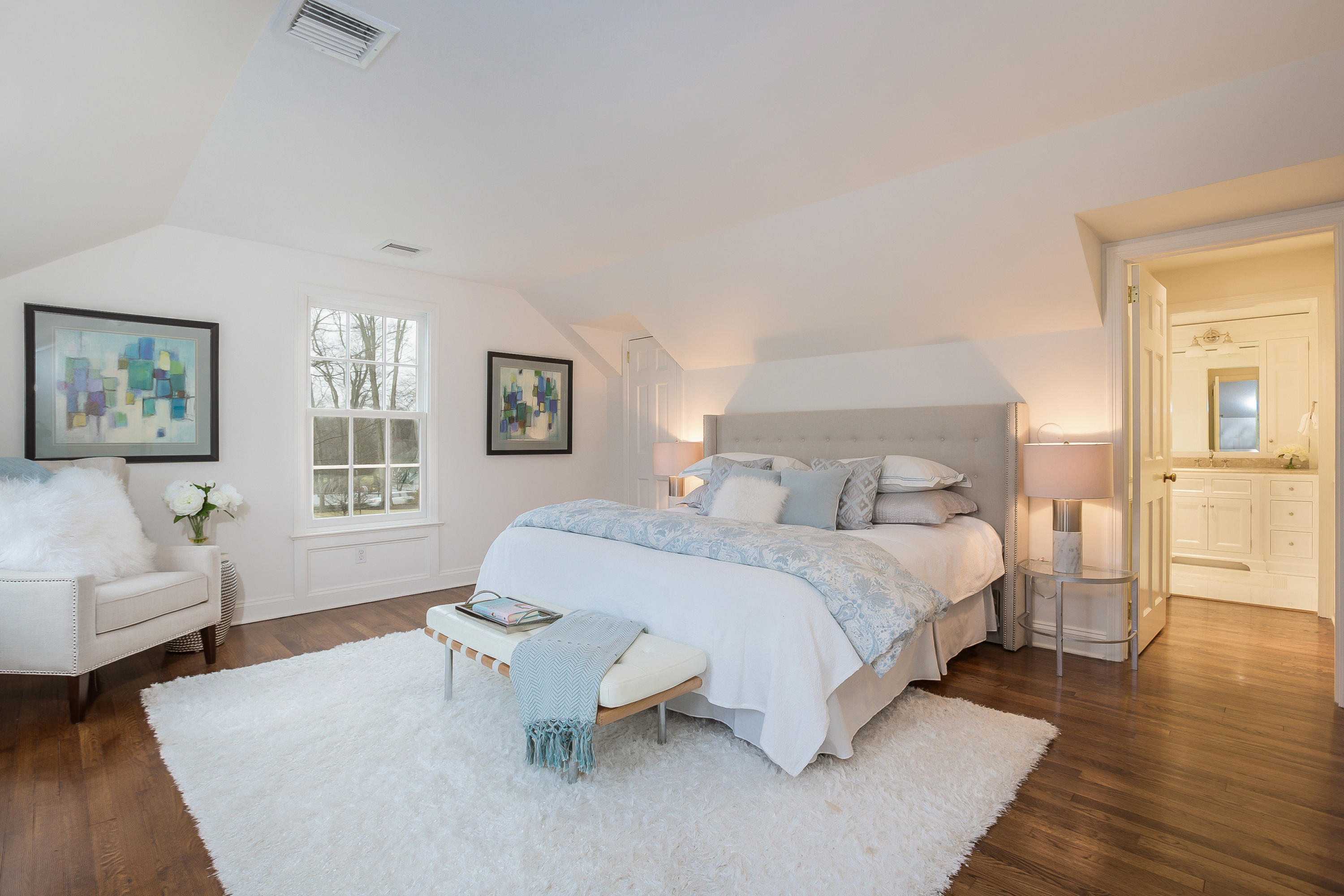 256 Brookside Road Darien, CT 06820 - Photo 28 of 66 a spacious bedroom with a bed a couch and dresser