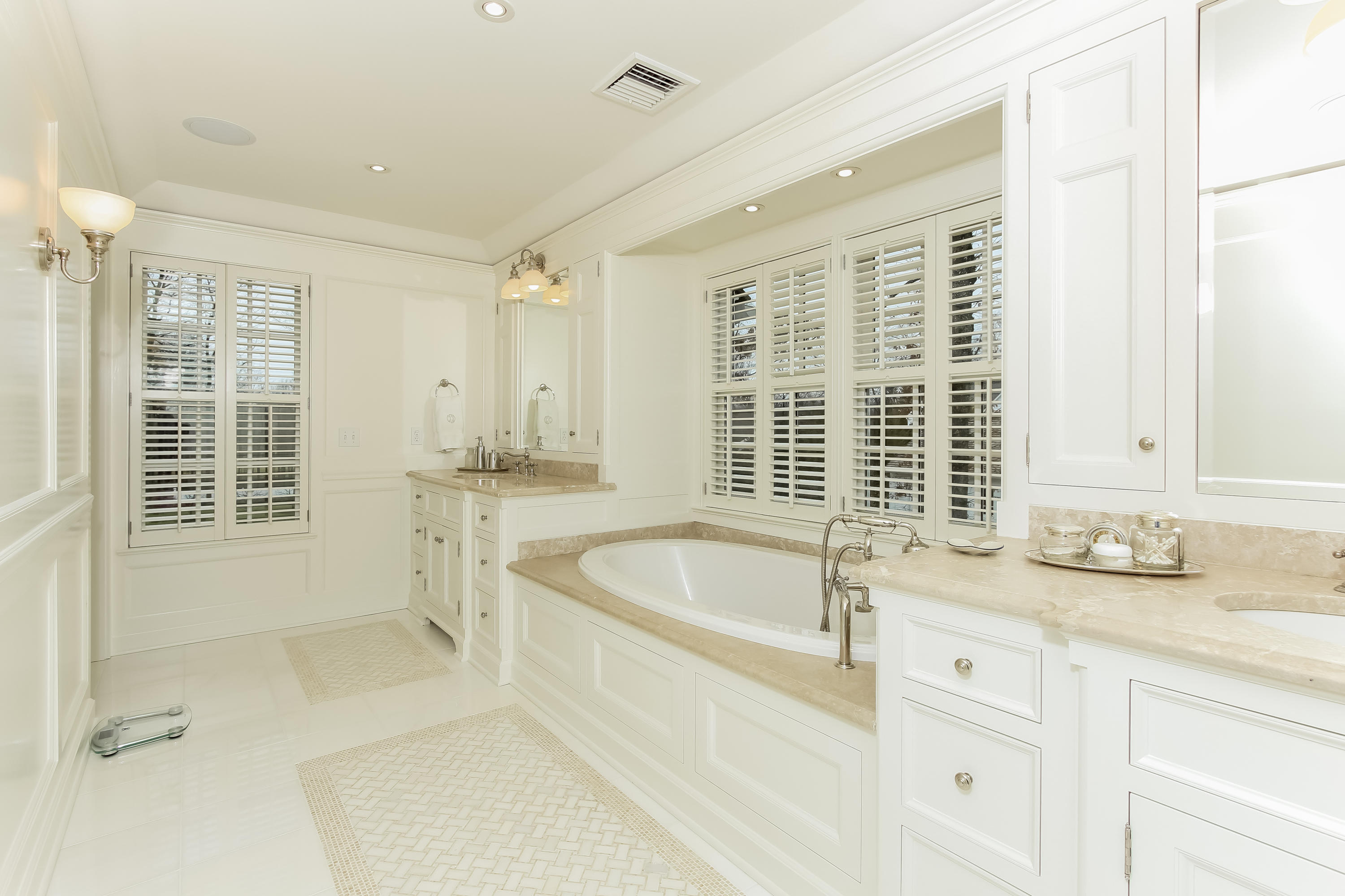 256 Brookside Road Darien, CT 06820 - Photo 29 of 66 a bathroom with a tub sink and mirror